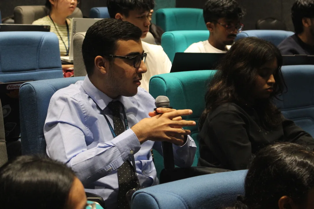 Attendee engaging with the discussion
