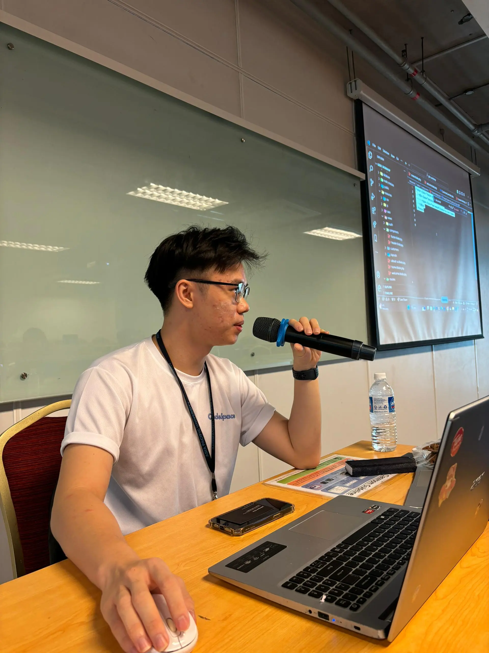 Trainer presenting code on projector screen