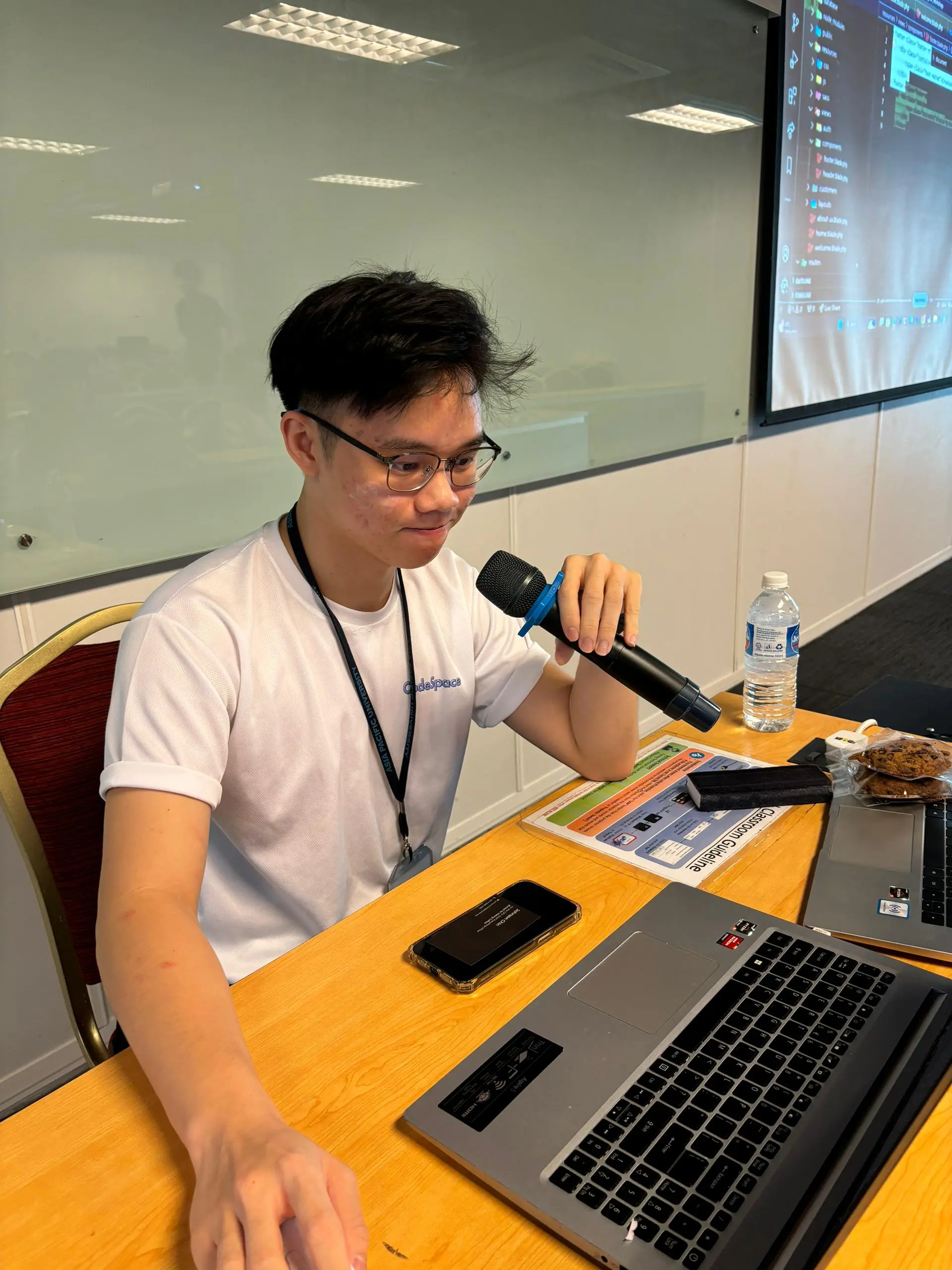 Trainer presenting with microphone